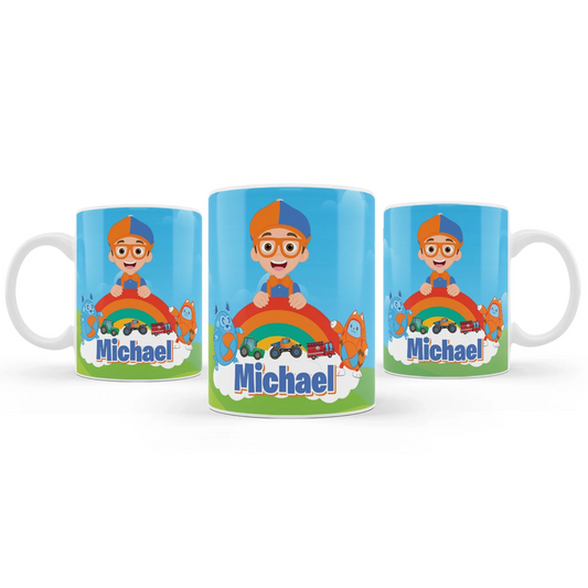 Blippi sublimation mug with blue and orange wrap design, ceramic mug shown on white background
