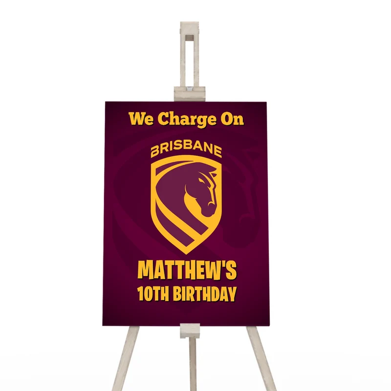 Brisbane Broncos welcome sign displaying a team greeting layout on a wooden display easel