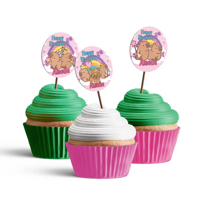 Capybara personalized cupcake toppers shown as small round themed decorations on wooden sticks flat lay