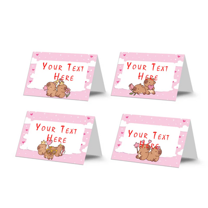 Capybara food cards featuring custom text on folded brown and green themed buffet tent labels flat lay