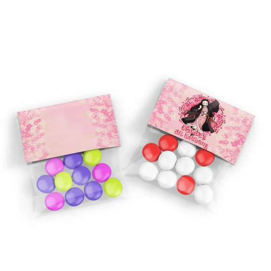 Demon Slayer Nezuko treat bag topper label folded over a clear plastic favor bag filled with pink candies