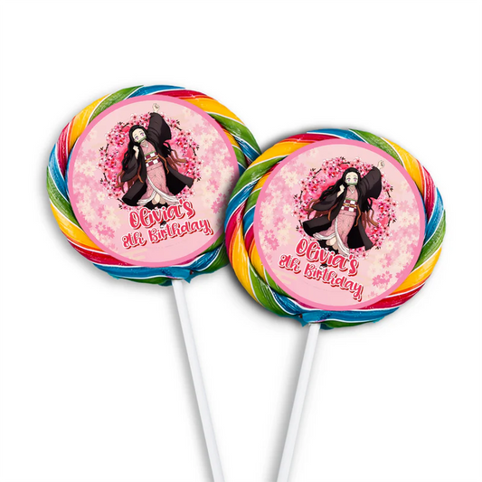 Demon Slayer Nezuko lollipop label mockup showing round stickers attached to pink cellophane wrapped suckers