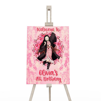 Demon Slayer Nezuko welcome sign displayed on an easel featuring a pink cherry blossom border for a party entrance