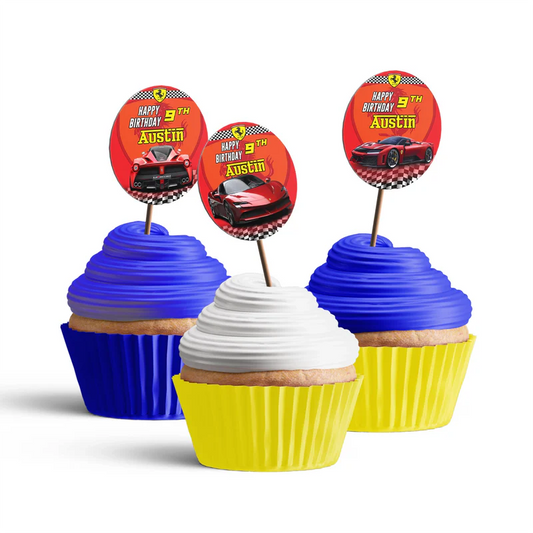 Ferrari cupcake toppers featuring round red and black racing logos on sticks arranged in flat lay
