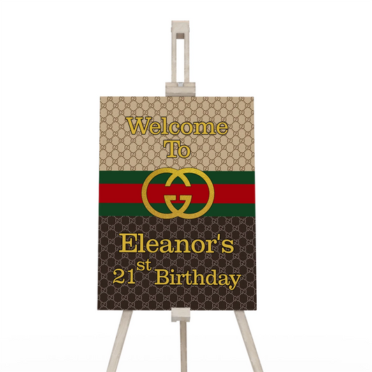 Gucci inspired welcome sign with luxury pattern and guest greeting on easel display
