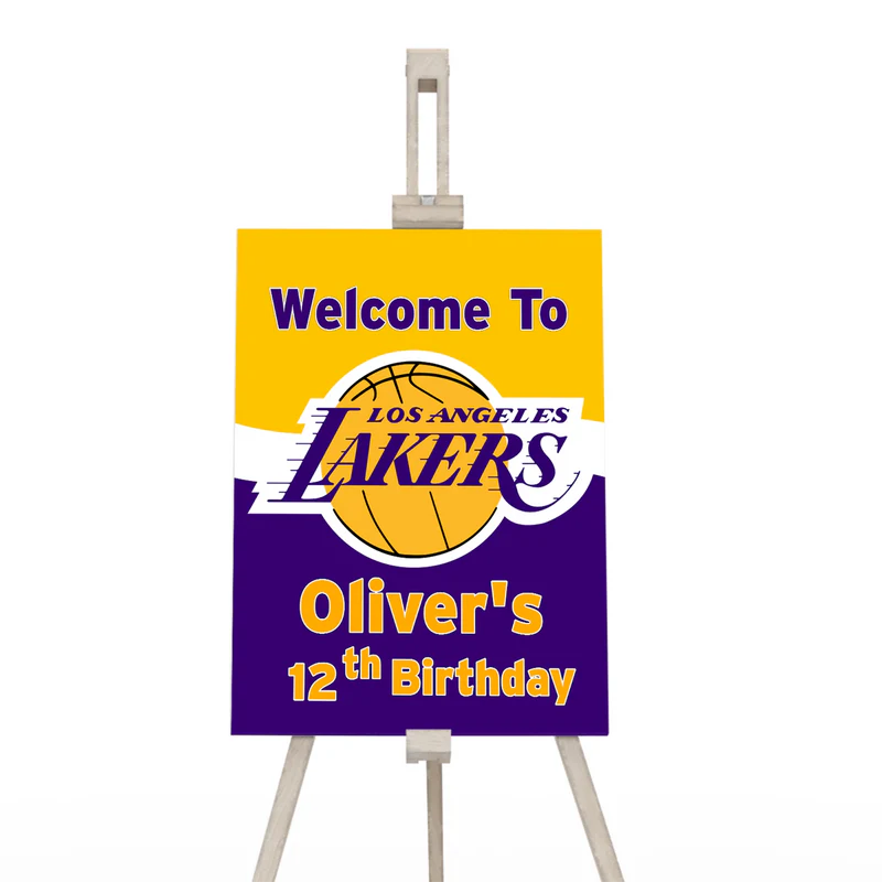LA Lakers welcome sign with purple and gold message on easel near party entrance