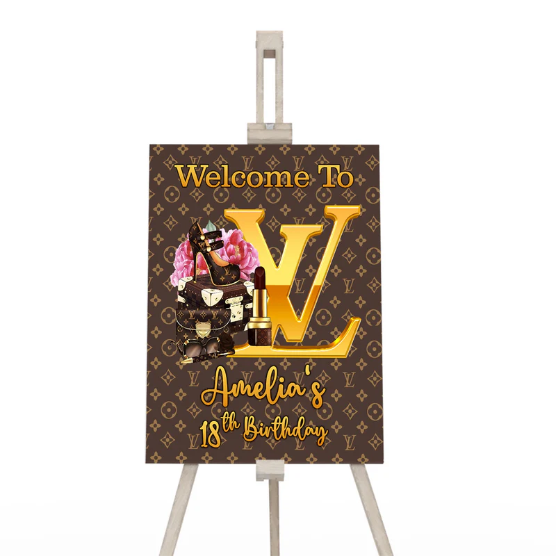 Louis Vuitton inspired welcome sign with bold script and monogram background on easel display