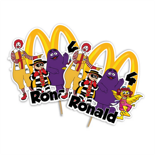 McDonalds cake toppers featuring red background and yellow arches arranged on wood surface