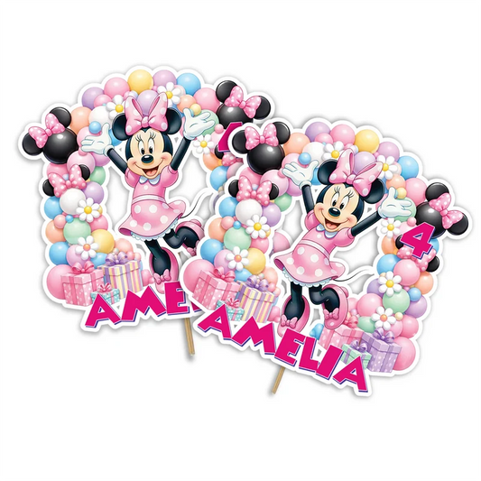 Minnie Mouse personalized cake toppers featuring iconic bow graphics on a modern dessert table display
