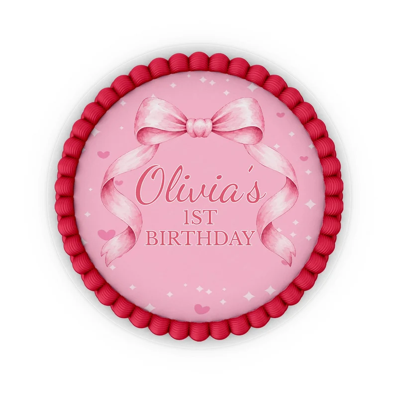 Pink Bow edible icing cake images with soft pink ribbon accents placed on a frosted round cake
