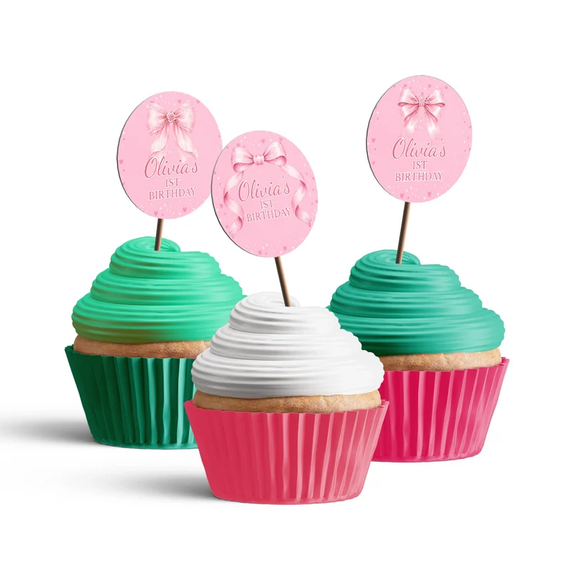 Pink Bow personalized cupcake toppers arranged neatly on frosted treats against a neutral backdrop