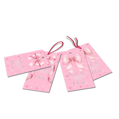 Pink Bow thank you tags with elegant script text accents displayed on a neatly wrapped party favor box