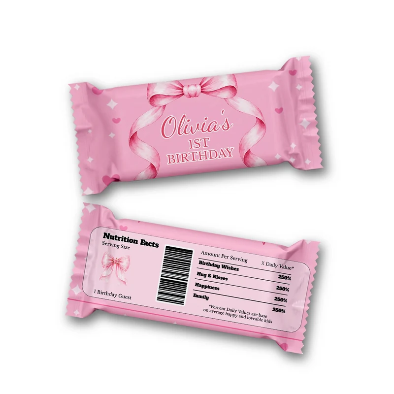 Pink Bow Rice Krispies treats and candy bar labels shown together in a charming party snack display