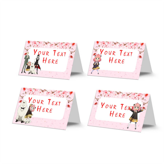 Spy X Family food cards featuring custom text on folded pink and black themed buffet tent labels flat lay