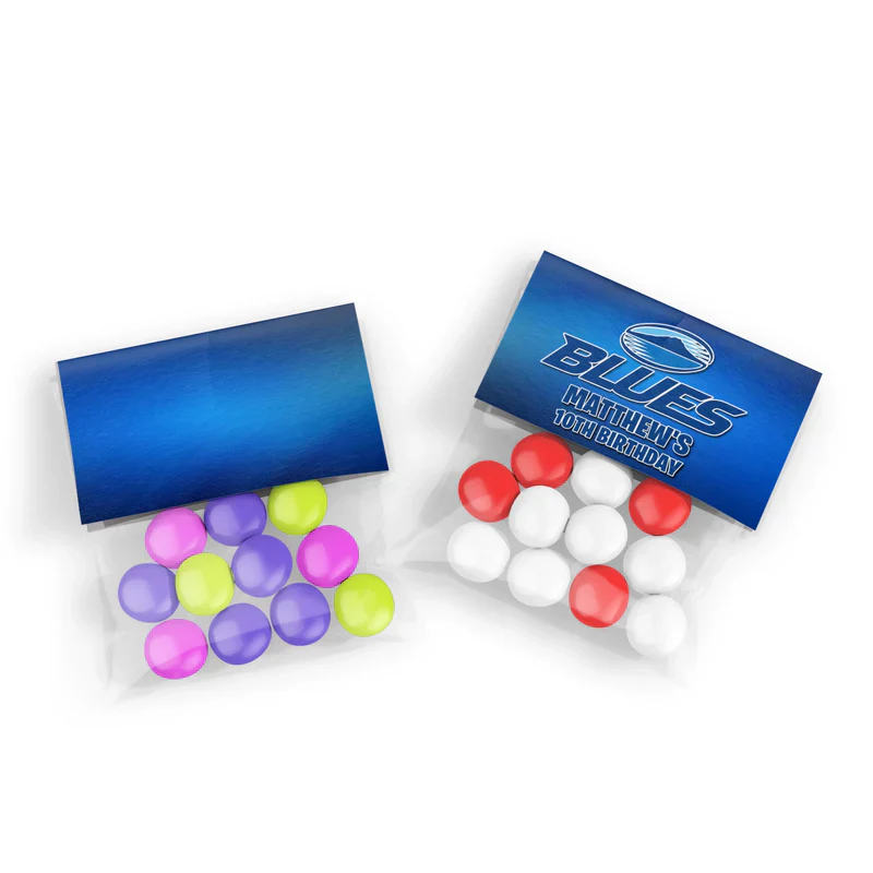 The Blues Rugby treat bag topper label folded neatly over clear cellophane party favors filled with team blue candy drops.