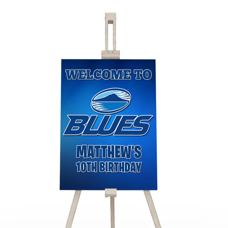 The Blues Rugby welcome sign featuring a large vertical poster design with a smoky blue rugby stadium background texture.