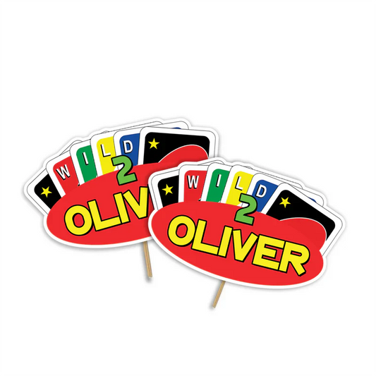 Uno cake toppers with bold number and color design, printed cutouts on card stock, flat lay view